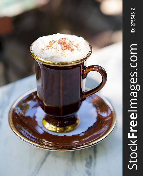 Cup of coffee on a table outdoors