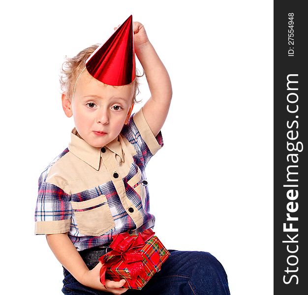 Portrait of a little boy holding a gift, isolated