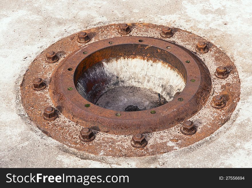 Old rusty manhole. Abstract industrial object.