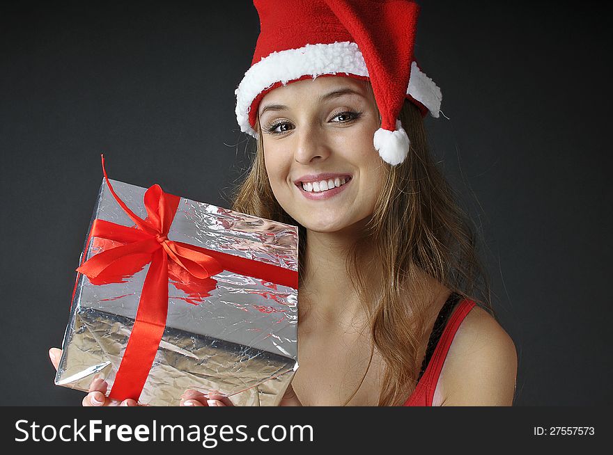 Christmas smiling  girl  holds  gift