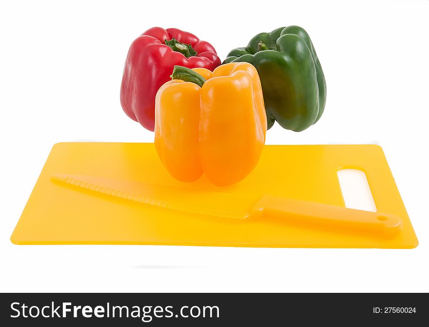 Colorful bell peppers on cutting board. Colorful bell peppers on cutting board