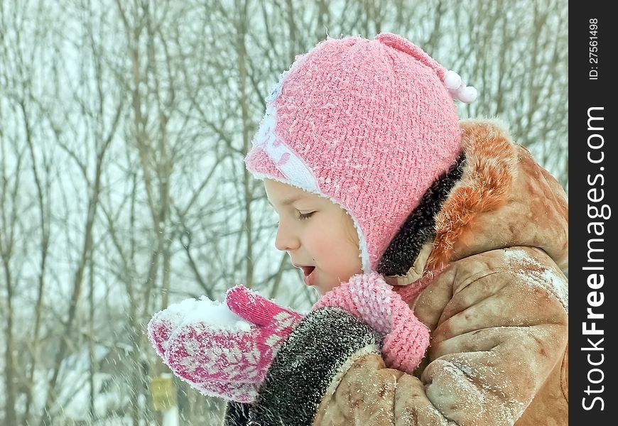 Sweet girl with snow in hands. Sweet girl with snow in hands