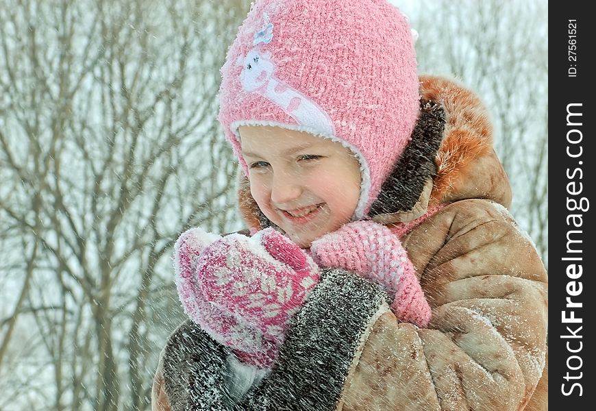 Sweet girl with snow in hands. Sweet girl with snow in hands