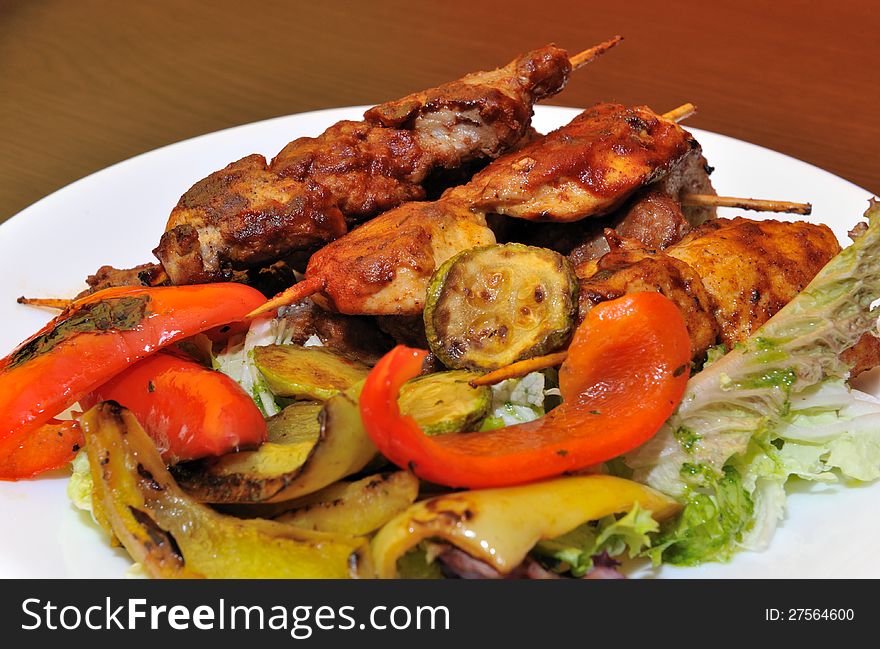 Appetizer roasted meat on a skewer in pizzeria,horizontal. Appetizer roasted meat on a skewer in pizzeria,horizontal