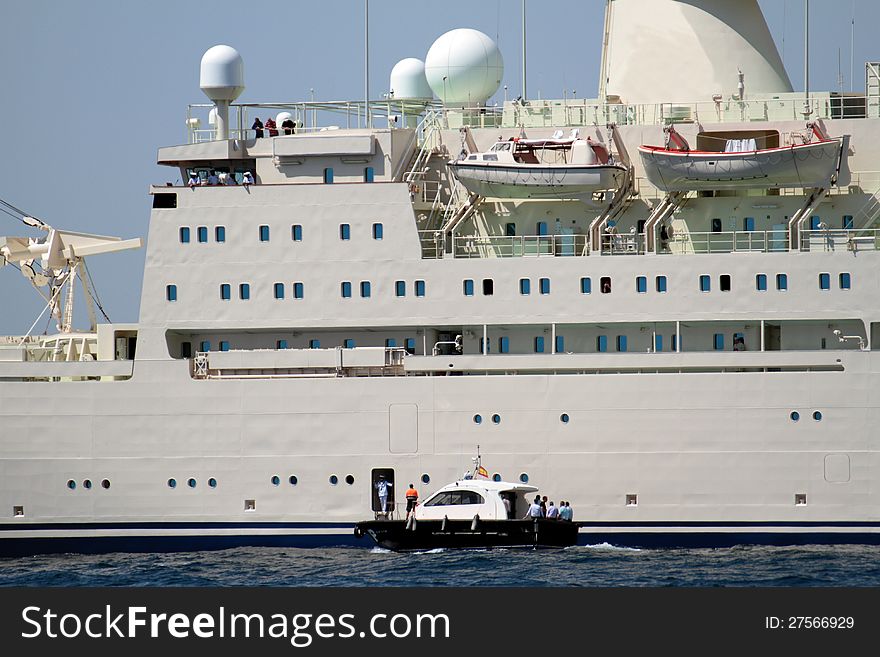 Merchant ship leaving port with the pilot cutter. Merchant ship leaving port with the pilot cutter.