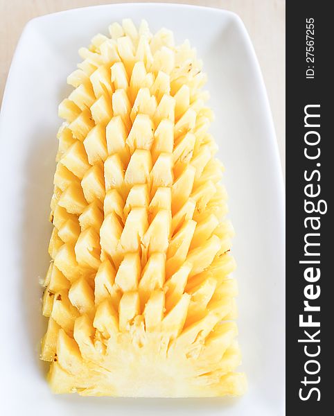 Pineapple Sliced On White Plate