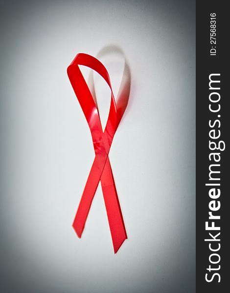 A Red Ribbon signifying support for AIDS/HIV awareness. A Red Ribbon signifying support for AIDS/HIV awareness