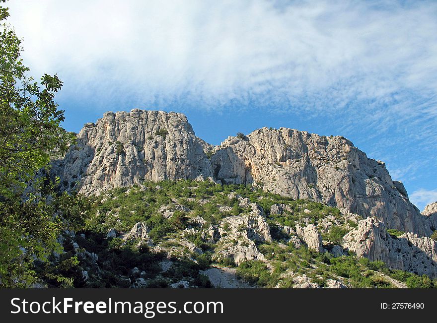 The Mountain tops in Horvatii on background sky. The Mountain tops in Horvatii on background sky.