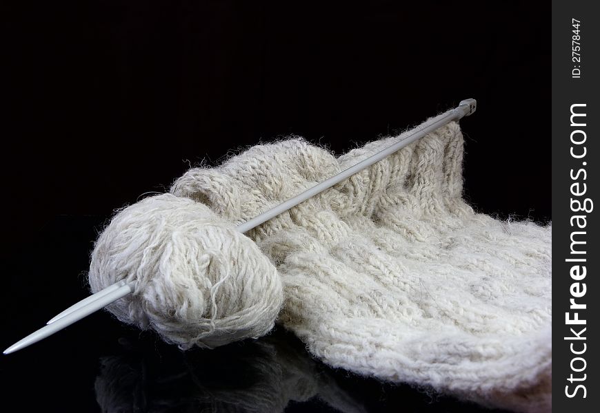 Knitting on a Black Background