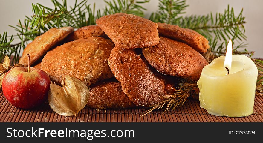 Christmas cookies with candles and apple