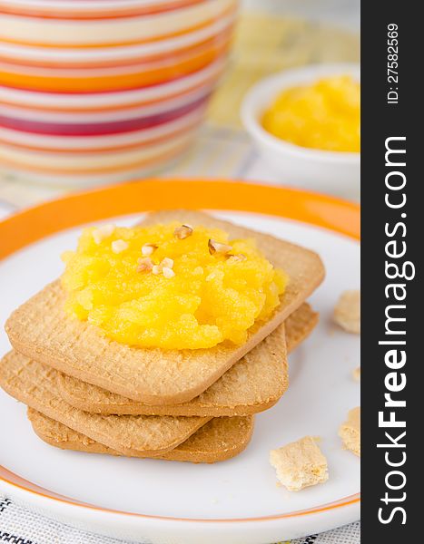 Biscuits with orange marmalade closeup