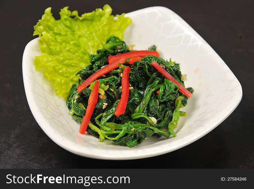 Chinese appetizers, TSpinach and red pepper. Chinese appetizers, TSpinach and red pepper
