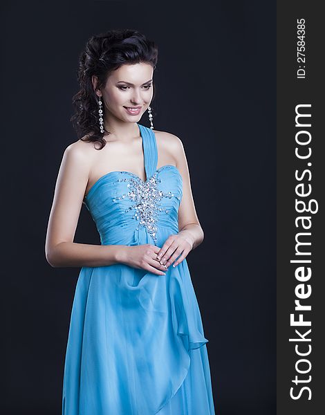 Cute female in fashionable vogue blue dress