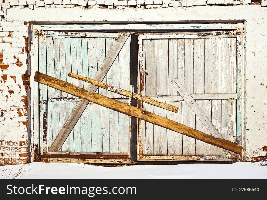 Board up gate of old cowshed. Board up gate of old cowshed