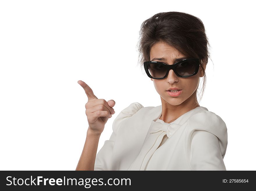 Portrait of pretty brunette in sunglasses posing in the studio on a white background. Portrait of pretty brunette in sunglasses posing in the studio on a white background