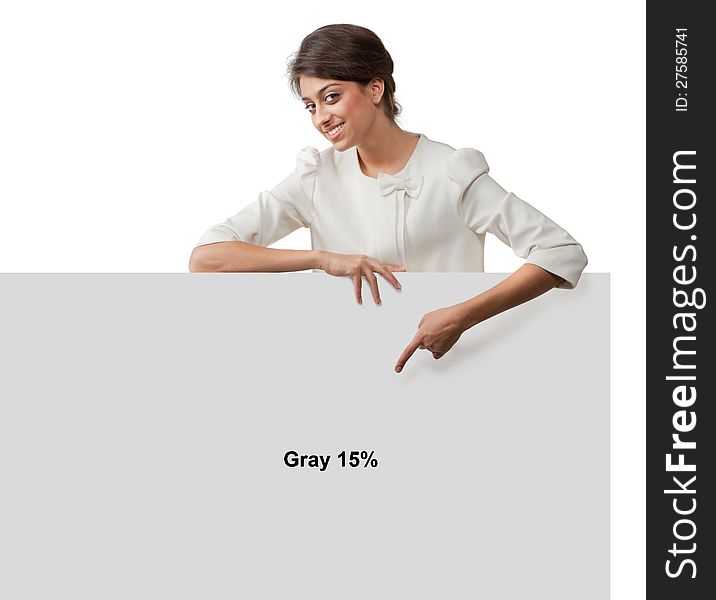 Portrait of a young pretty girl with a booth demonstrates the gray color and free space on it for anything in the studio. Portrait of a young pretty girl with a booth demonstrates the gray color and free space on it for anything in the studio