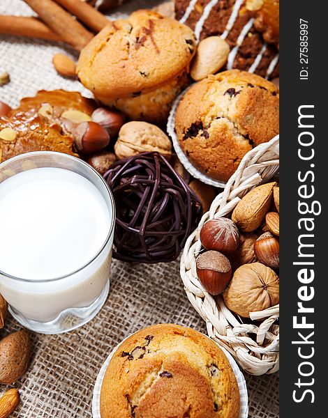 Delicious fresh baked muffins, milk and nuts. Delicious fresh baked muffins, milk and nuts