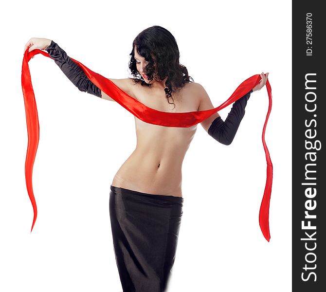 Photo attracting woman in exotic dress with red ribbon, posing in studio on white background. Photo attracting woman in exotic dress with red ribbon, posing in studio on white background