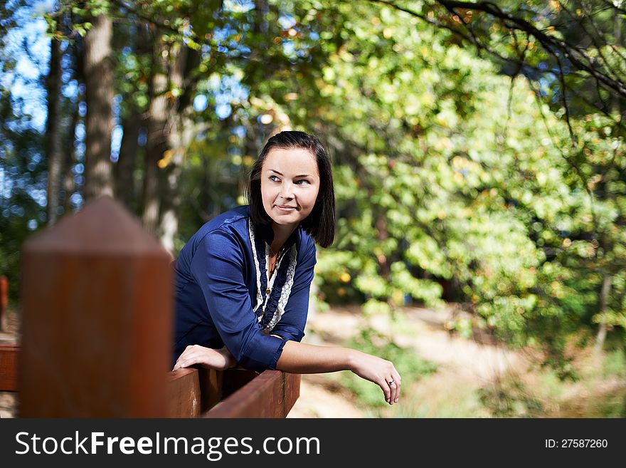 Romantic young woman in a summer park