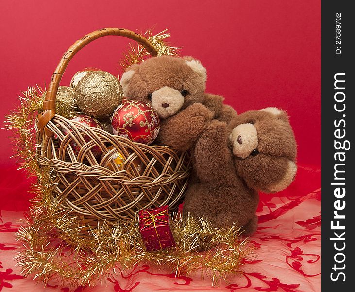 Teddy Bears and a basket with Christmas toys. Teddy Bears and a basket with Christmas toys.