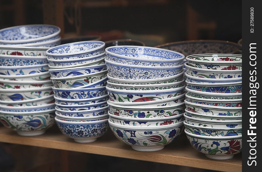 Traditional turkish souvenir bowls on a shelf. Traditional turkish souvenir bowls on a shelf