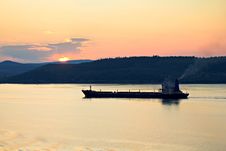 Cargo Ship At Sunset Stock Photo Cargo Ship At Sunset Stock Photo