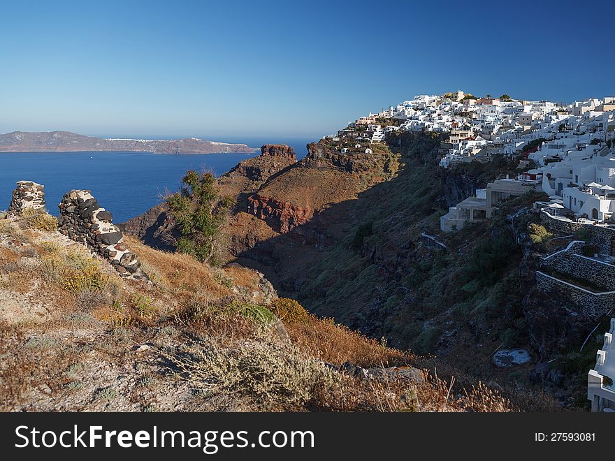 The extraordinary view of the caldera. The houses are hanging from the cliff. The extraordinary view of the caldera. The houses are hanging from the cliff.