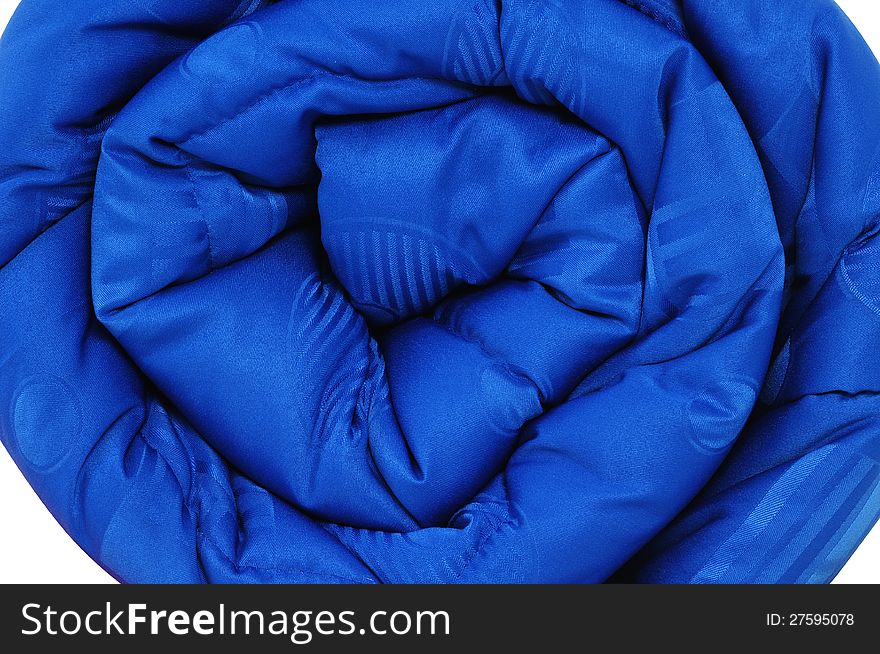 Close up of a rolled up comforter. Close up of a rolled up comforter.