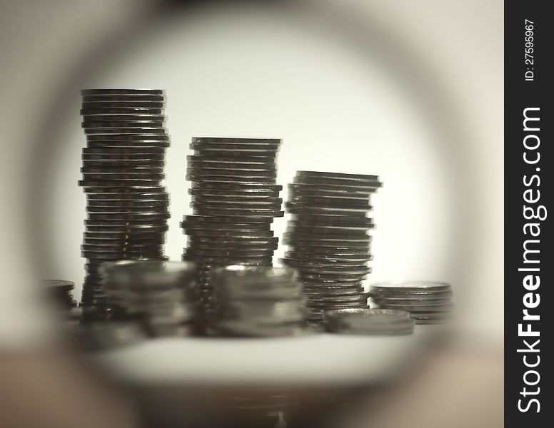 Stack of coins photographed through a magnifier