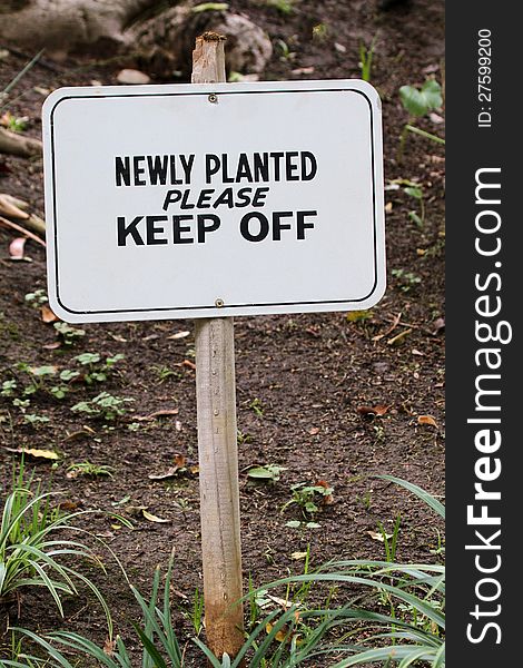 Warning sign to stay away from planted areas. Warning sign to stay away from planted areas
