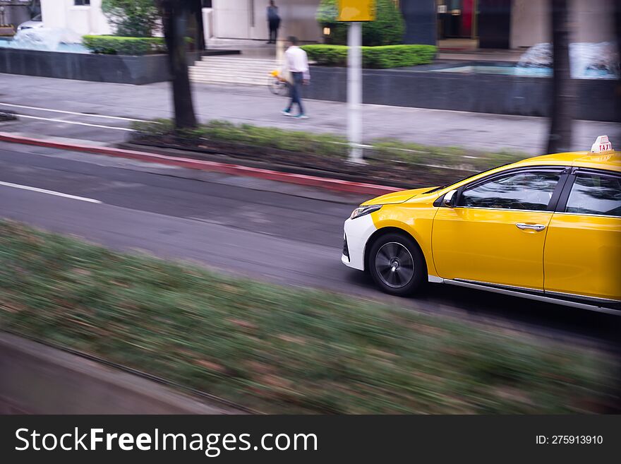 Yellow Taxis Run On The Road To Pick Up Passengers