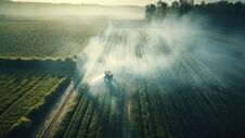 Generative AI, Farm Agriculture Watered Or Pesticides Spray Green Fields. Royalty Free Stock Photography