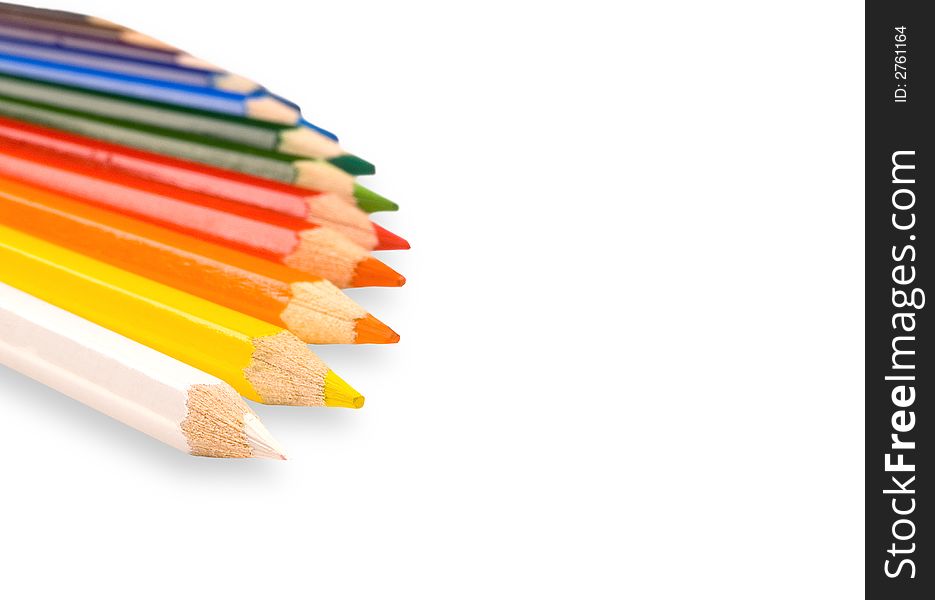 Color pencils lay on a white background. Color pencils lay on a white background