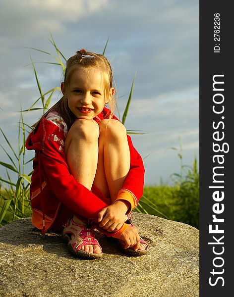 Girl On Stoun Near Sea