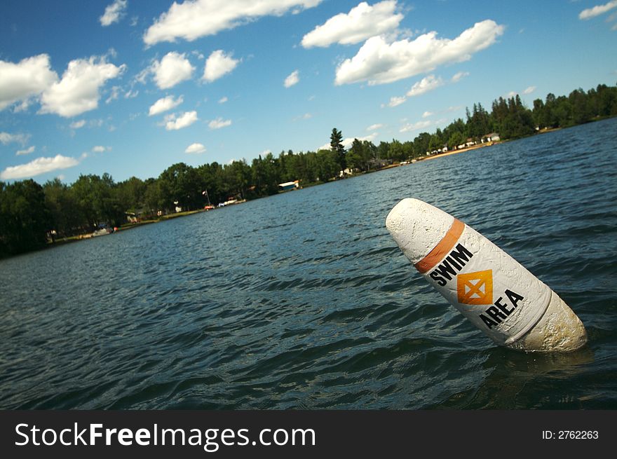 Lake Scene & Swim Area Buoy On A Summer Day. Lake Scene & Swim Area Buoy On A Summer Day