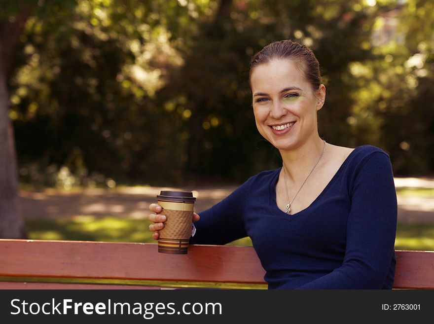 Woman smiling with coffee cup