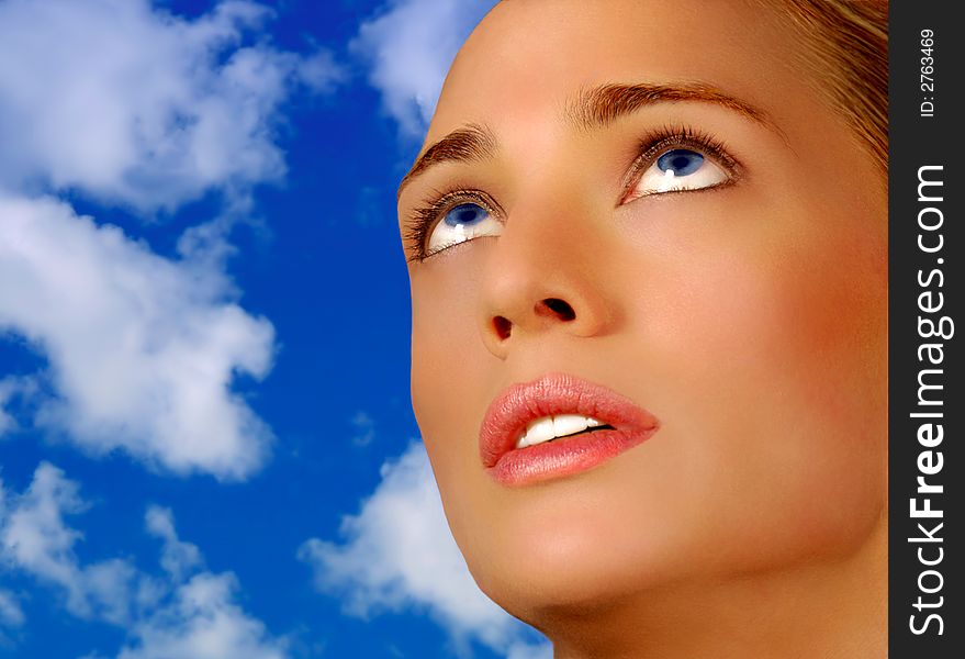 Classic Pose Of Beautiful Blond Model On Blue Sky. Classic Pose Of Beautiful Blond Model On Blue Sky