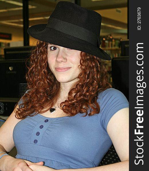 Student wearing black hat while taking break from studying. Student wearing black hat while taking break from studying