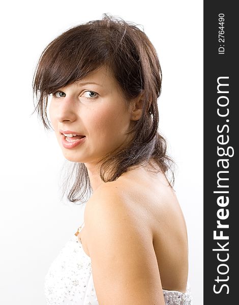 Beautiful white woman in a wedding dress isolated on a white background posing. Beautiful white woman in a wedding dress isolated on a white background posing