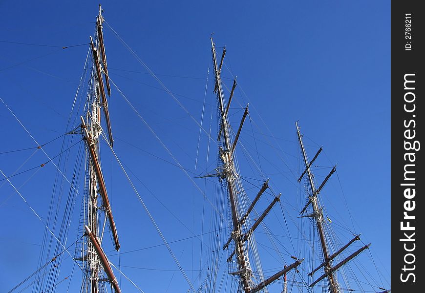 Sailing ship with masts in port