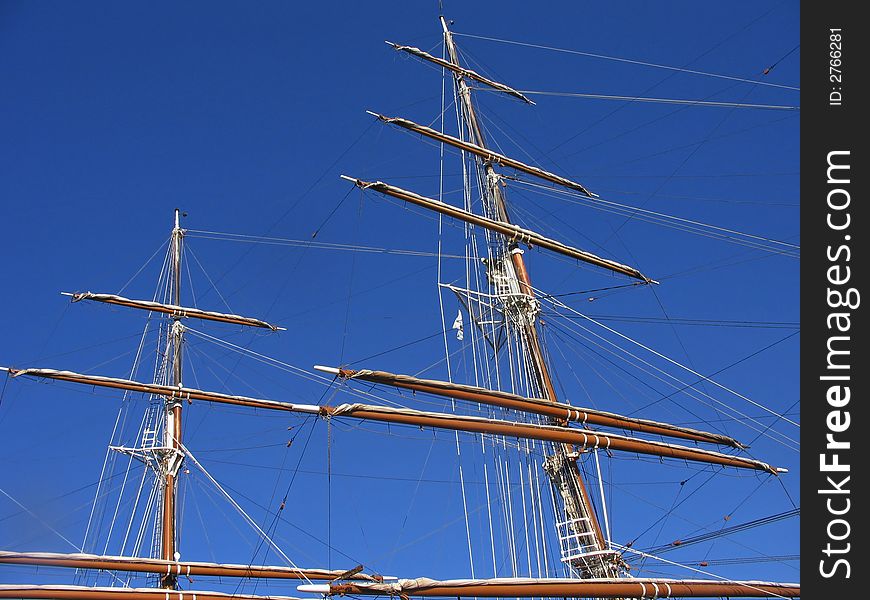Sailing ship with masts in port. Sailing ship with masts in port