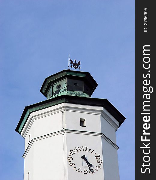 White clock tower and blue sky