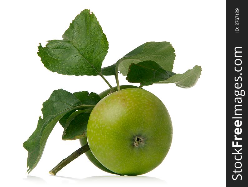 Green apple and leaves isolated over white background