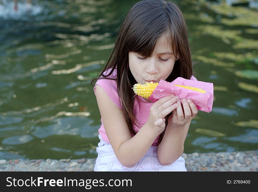 Girl Eating Corn