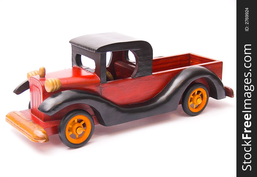 Wooden car toy - isolated over white background. Wooden car toy - isolated over white background