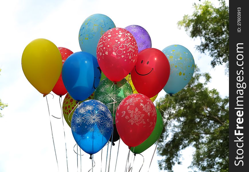 Flying colorfull balloons over blue sky