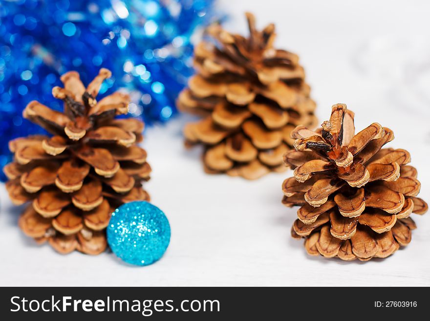 Christmas decoration with three cones and blue glitter balls. Christmas decoration with three cones and blue glitter balls