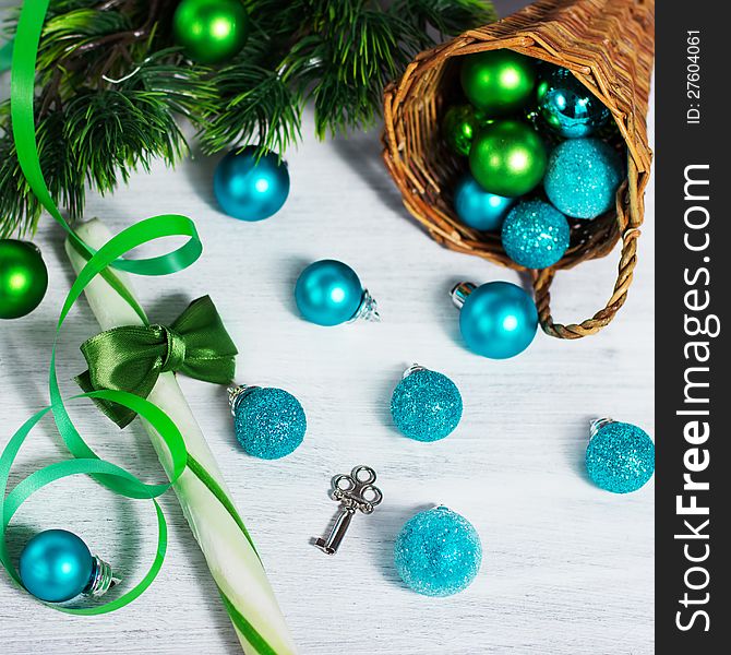 Christmas decoration with lollipop and blue balls on rusty white background