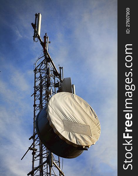 Telecommunication tower with antennas on blue sky. Telecommunication tower with antennas on blue sky