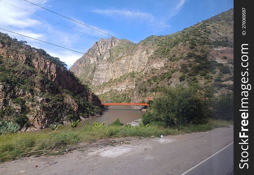 Bridge Crossing The River In The Andes Of Peru